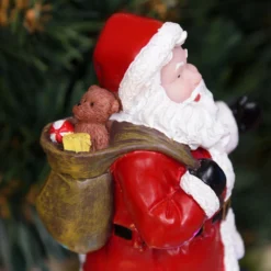 Babbo Natale con Elfi in movimento rotatorio, h 19 cm, musiche natalizie