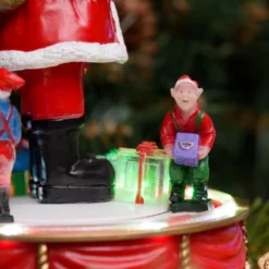 Babbo Natale con Elfi in movimento rotatorio, h 19 cm, musiche natalizie