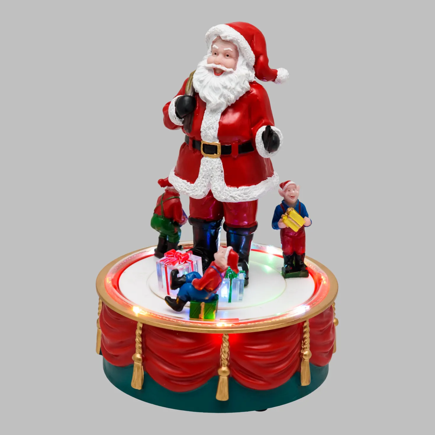 Babbo Natale con Elfi in movimento rotatorio, h 19 cm, musiche natalizie