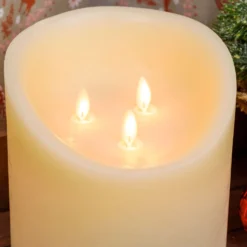 Candela in cera ruvida avorio con 3 fiamme, h 15 cm