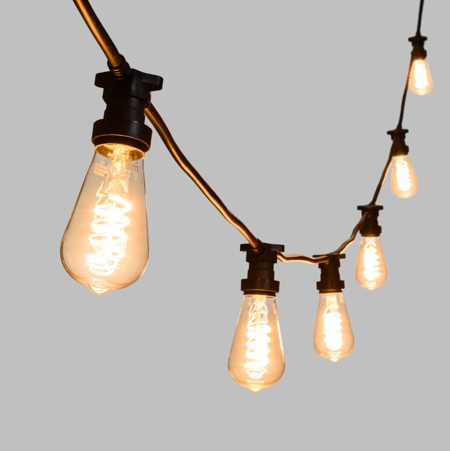 Catena 5 m, 8 lampadine Edison Ø 64 mm di 4 Watt, led a spirale, cavo nero, prolungabile