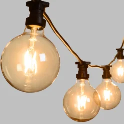 Catena 5 m, 5 lampadine globo Ø 125 mm di 4 Watt led, cavo nero, prolungabile