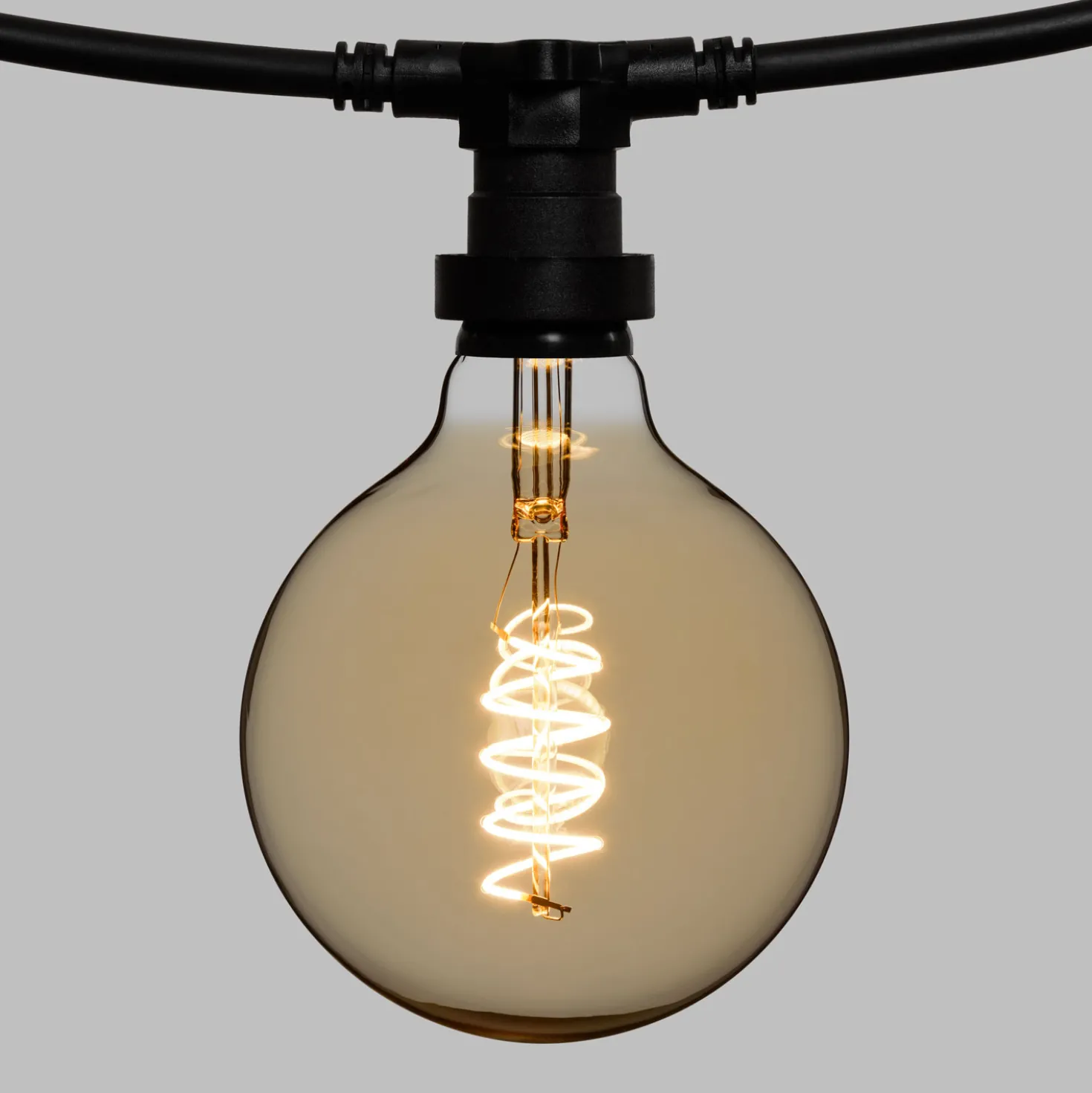 Catena 5 m, 8 lampadine globo Ø 125 mm di 4 Watt, led a spirale, cavo nero, prolungabile