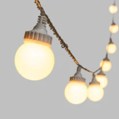 Catena 5 m, 10 sfere bianche Ø 50 mm, led bianco caldo, cavo trasparente, prolungabile