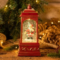 Lanterna natalizia a batteria rosso antico con nevicata glitter, h. 20,5 cm