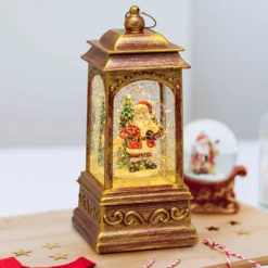 Lanterna natalizia a batteria rosso antico con nevicata glitter, h. 20,5 cm