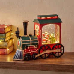 Locomotiva Verde-Rosso-Oro, glitter scintillanti, h 20 cm, led bianco caldo, musiche natalizie