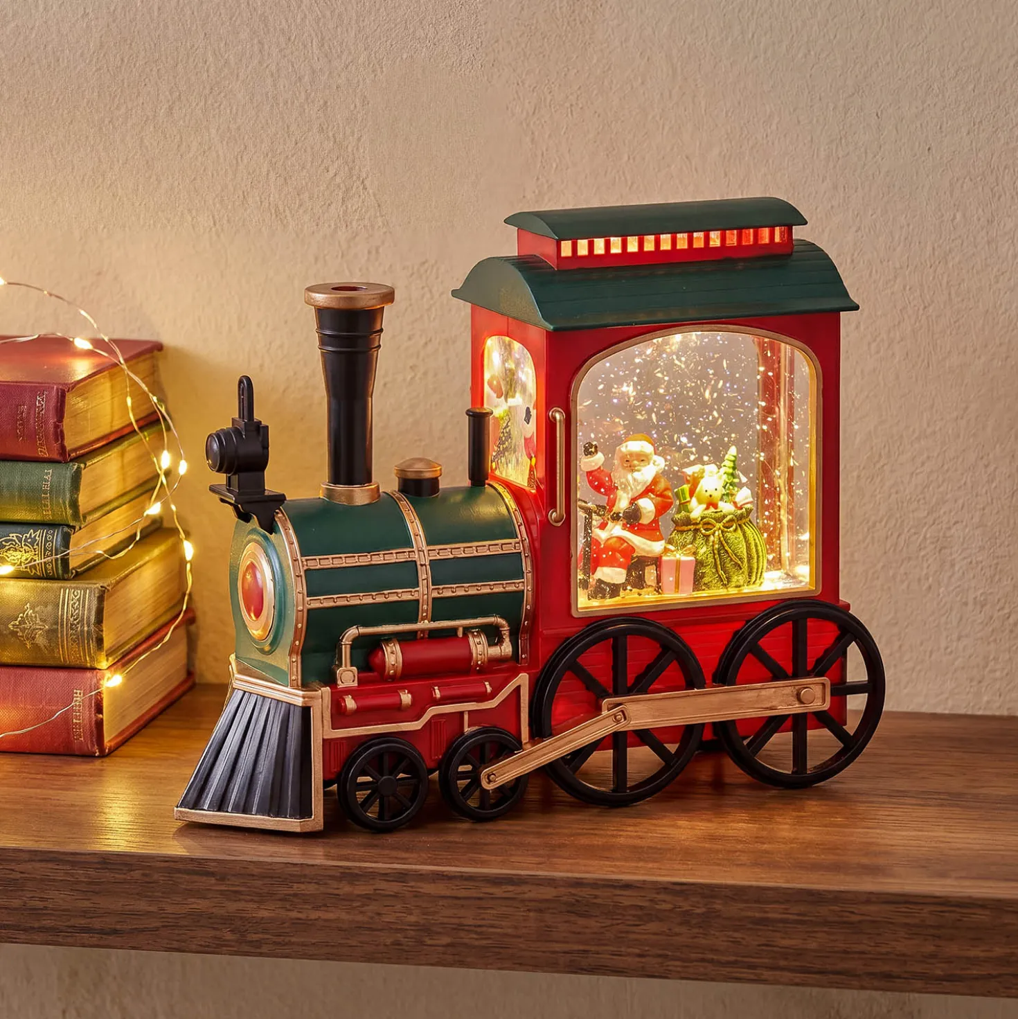 Locomotiva Verde-Rosso-Oro, glitter scintillanti, h 20 cm, led bianco caldo, musiche natalizie