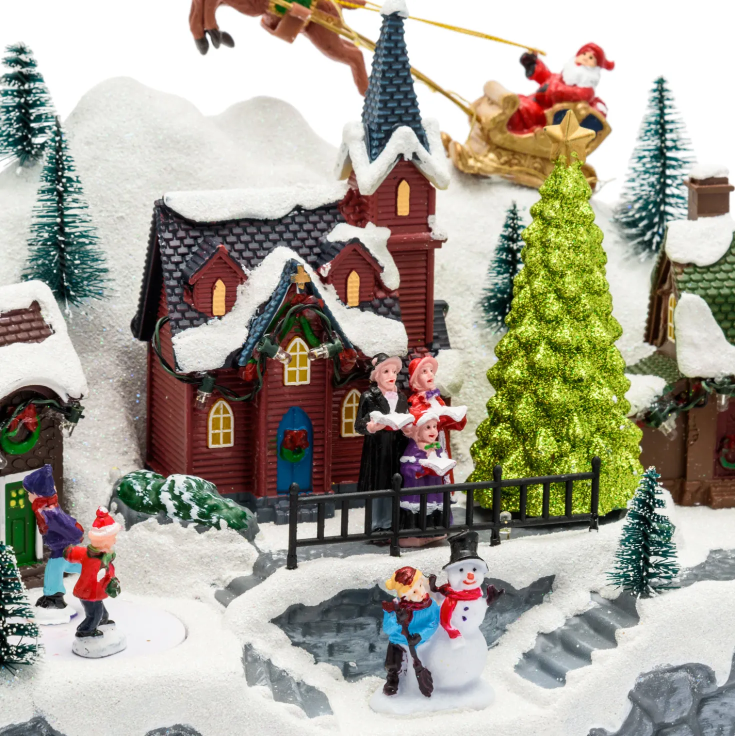 Paesaggio natalizio con Babbo Natale su slitta volante e pattinatori in movimento, led multicolor