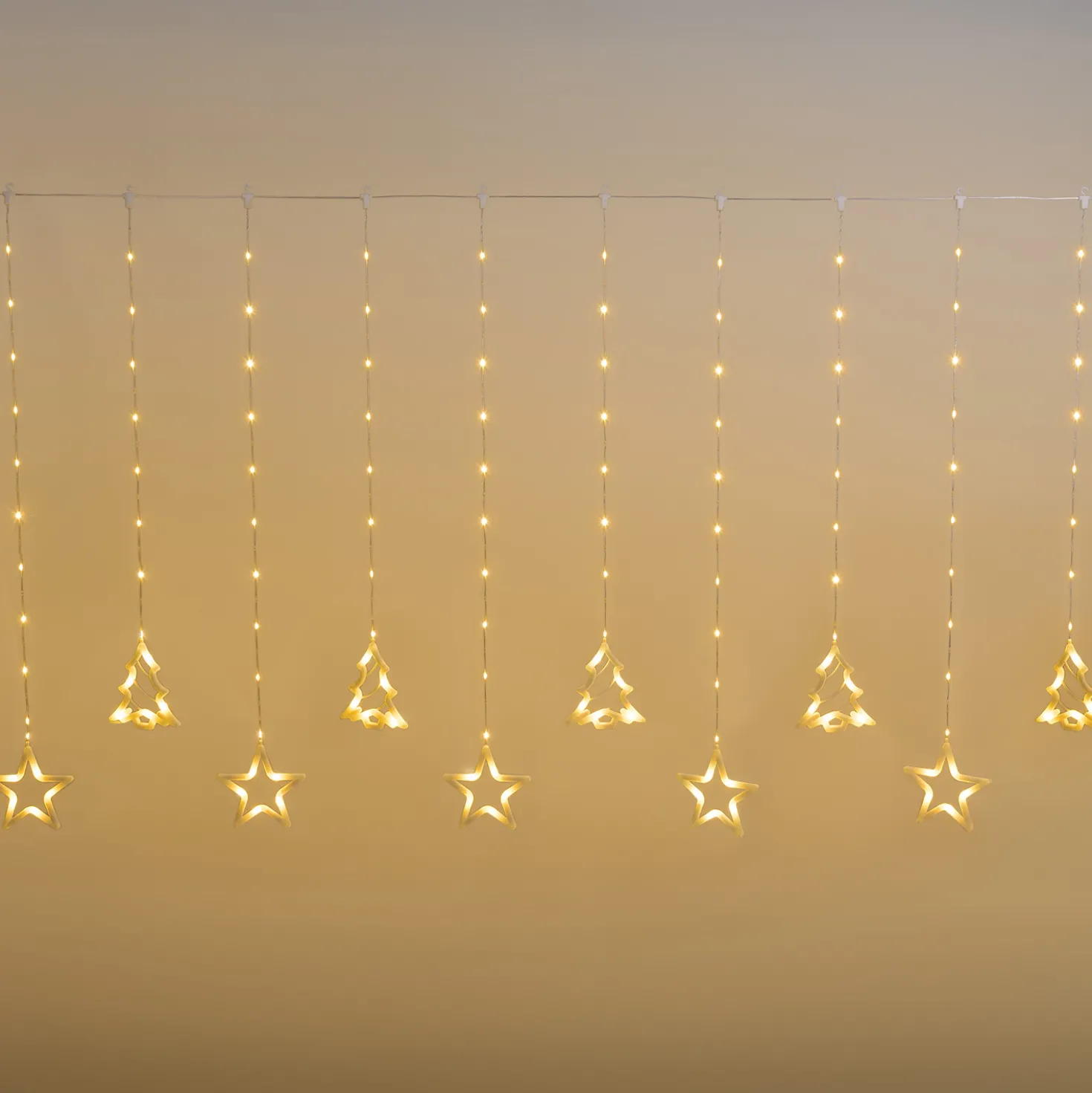 Stalattite con 20 decorazioni stelle e alberi, 4,75 x h 1,15 m, 560 Gocce di Luce, led bianco caldo, cavo trasparente