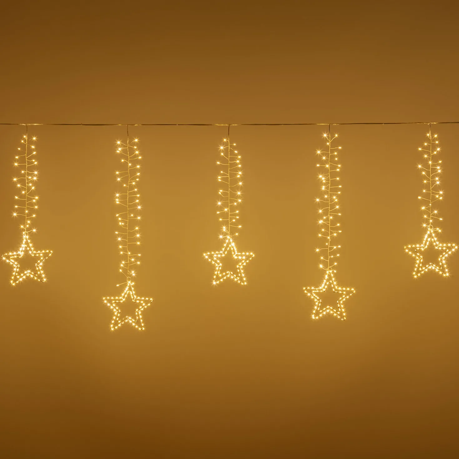 Stalattite decorata con stelle 3,2 x h 0,8 m, 950 microled bianco caldo
