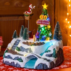 Villaggio di Natale, Albero e Babbo che lo decora in movimento, h 22 cm