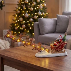 Villaggio di Natale, Babbo Natale su slitta e renne volanti, h 16 cm, led bianco caldo