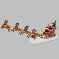 Villaggio di Natale, Babbo Natale su slitta e renne volanti, h 16 cm, led bianco caldo