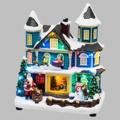 Villaggio di Natale, Casa con scena natalizia, Slitta in movimento e Albero di Natale RGB, h 23 cm, musiche natalizie