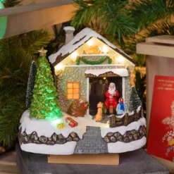 Villaggio di Natale, Casa di Babbo Natale con Albero di Natale rotante, h 17 cm, musiche natalizie