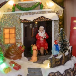 Villaggio di Natale, Casa di Babbo Natale con Albero di Natale rotante, h 17 cm, musiche natalizie