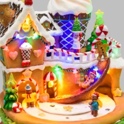 Villaggio di Natale, Casa di Marzapane con personaggi in movimento, h 21 cm, musiche natalizie