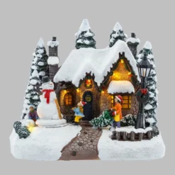 Villaggio di Natale, Casa innevata nel Bosco con Pupazzo di Neve rotante, h 20 cm, musiche natalizie