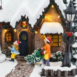Villaggio di Natale, Casa innevata nel Bosco con Pupazzo di Neve rotante, h 20 cm, musiche natalizie