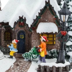 Villaggio di Natale, Casa innevata nel Bosco con Pupazzo di Neve rotante, h 20 cm, musiche natalizie