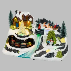 Villaggio di Natale con Paesaggio Innevato, Trenino e Babbo su Slitta rotanti, Ruscello fibre ottiche, h 18 cm, musiche natalizie