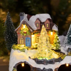 Villaggio di Natale con Paesaggio Innevato, Trenino e Babbo su Slitta rotanti, Ruscello fibre ottiche, h 18 cm, musiche natalizie