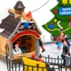 Villaggio di Natale in Poliresina, Luna Park Lago Ghiacciato con Pattinatori in movimento, h 22 cm
