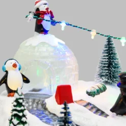 Villaggio di Natale, Paesaggio Polare con Igloo e Pinguini rotanti, h 16 cm, musiche natalizie