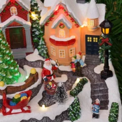 Villaggio di Natale, Paesaggio Innevato con personaggi e Albero di Natale rotante, h 18 cm, musiche natalizie
