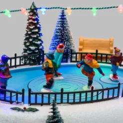 Villaggio di Natale, Pattinatori rotanti in movimento su pista, led multicolor