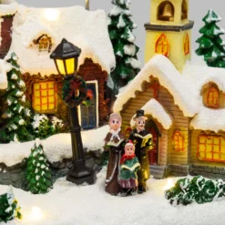 Villaggio Innevato con Chiesa e Babbo Natale su Slitta Volante con Renne in movimento, h 23 cm, musiche natalizie