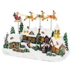 Villaggio Innevato con Chiesa e Babbo Natale su Slitta Volante con Renne in movimento, h 23 cm, musiche natalizie