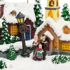 Villaggio Innevato con Chiesa e Babbo Natale su Slitta Volante con Renne in movimento, h 23 cm, musiche natalizie
