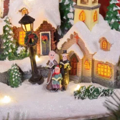 Villaggio Innevato con Chiesa e Babbo Natale su Slitta Volante con Renne in movimento, h 23 cm, musiche natalizie