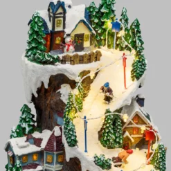 Villaggio Innevato con Sciatori, Trenino in Galleria in movimento in Polyresina, h 38 cm