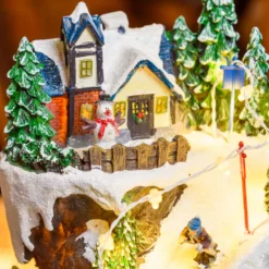Villaggio Innevato con Sciatori, Trenino in Galleria in movimento in Polyresina, h 38 cm