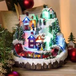 Villaggio innevato di Natale e Trenino con movimento rotante, h 22 cm, musiche natalizie